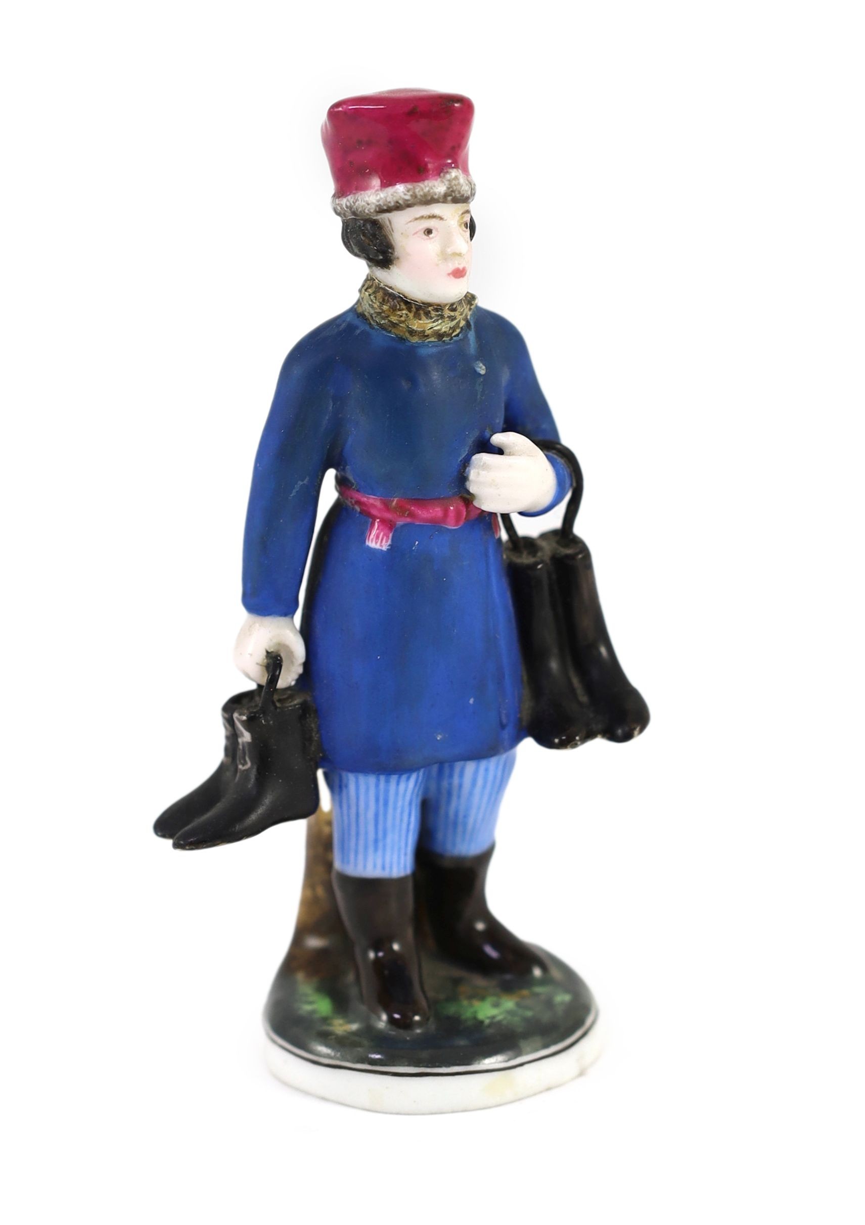 A Russian porcelain figure of a boot seller, Gardner Manufactory, Verbilki, c.1825, 10.8cm high, restoration